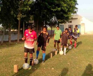 The girls use bricks as marking cones